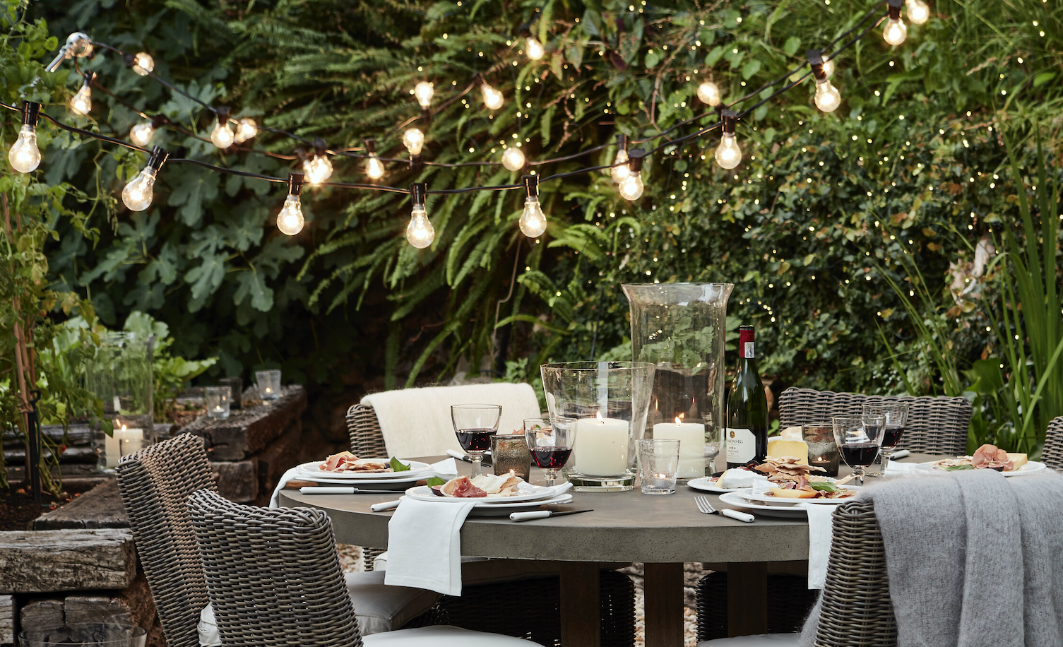Neptune Hudson table and Rosewood festoon lights